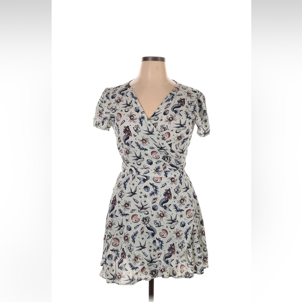 Wrap around dress with traditional tattoo print